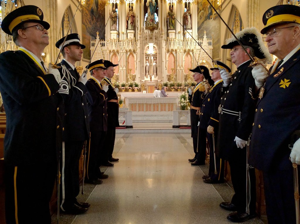 Knights of St. John honor guard with ceremonial swords in church